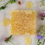 A square piece of food surrounded by flowers.